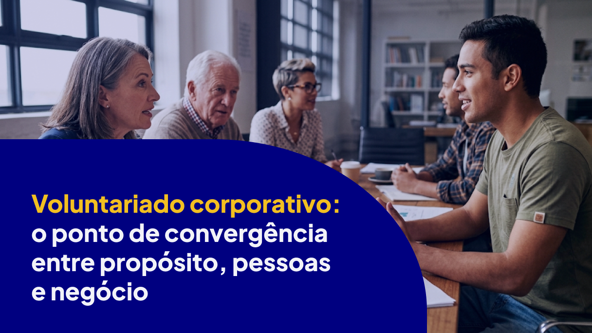 Grupo de pessoas de diferentes gerações reunidas à mesa em uma conversa sobre voluntariado corporativo, ilustrando a conexão entre propósito, pessoas e negócio